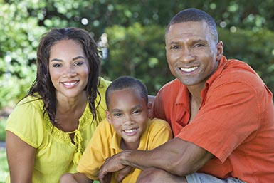 Happy family smiling after structured settlement qualifies for lump sum of cash