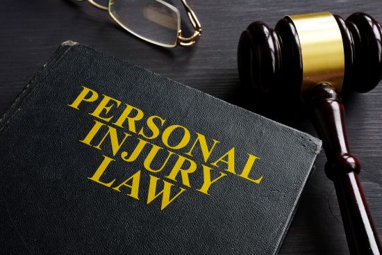Personal injury law book and gavel, illustrating the legal aspects of Vanessa Bryant's lawsuit over crash photos.