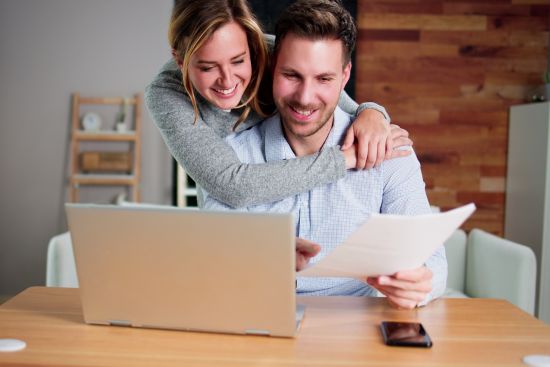 Couple celebrating financial relief after choosing a structured settlement cash-out option.