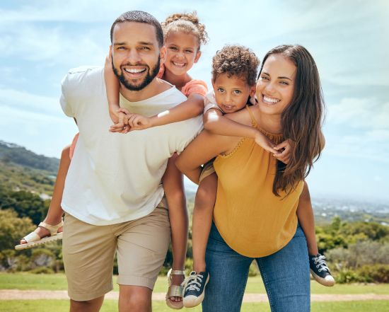 Happy family enjoying financial freedom after choosing a lump sum settlement option.