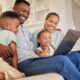 Family smiling while exploring structured settlement buyout options online